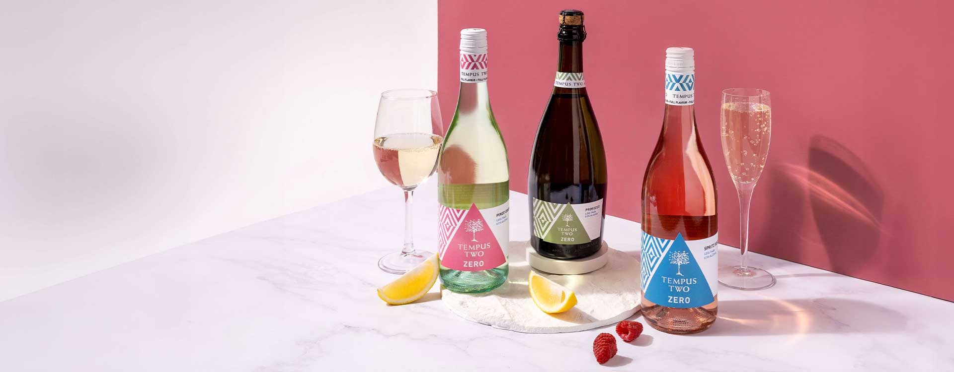 Tempus Two Lighten Up Rose bottle and glass on a table outdoors